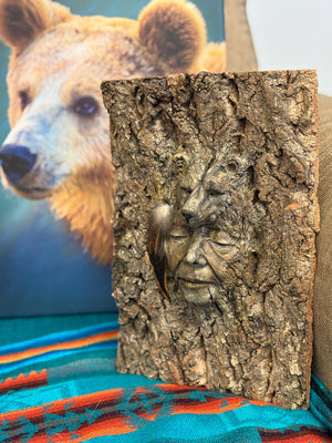 Side view of Bear Spirit of the Forest tree bark bear sculpture showing textured bark details