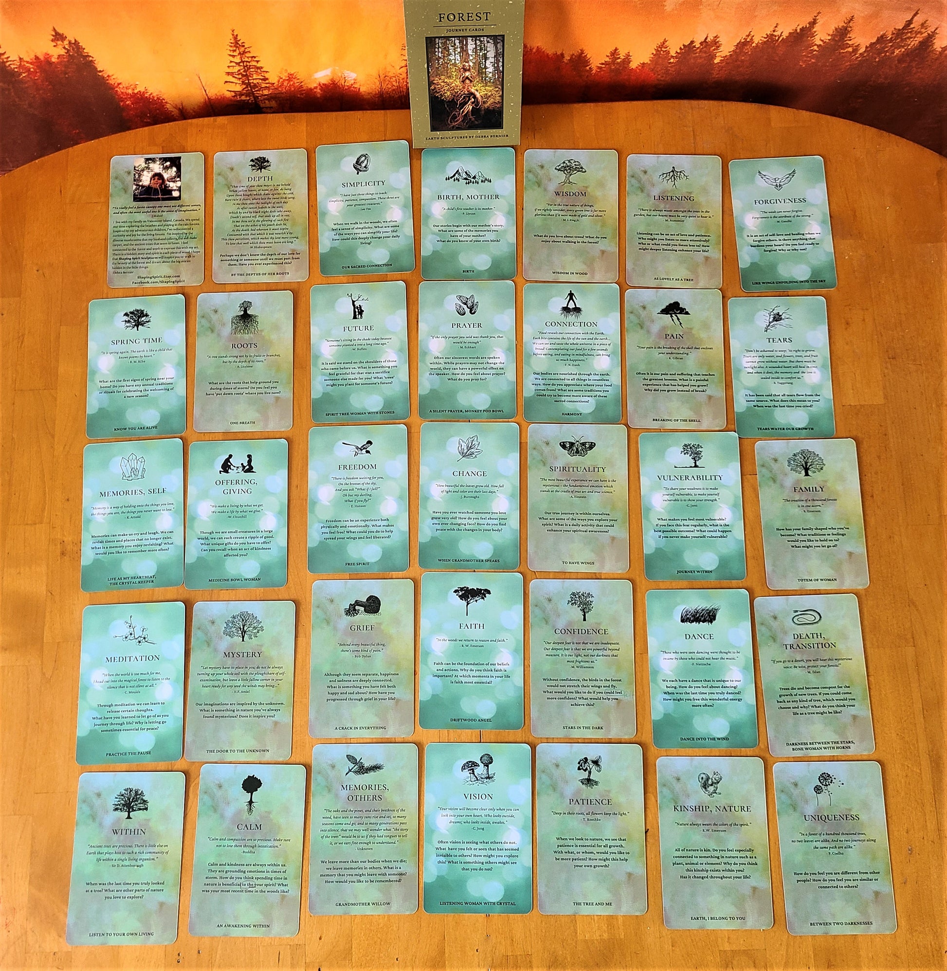 Spread of Forest Journey Deck cards showing the back of woodland artwork and inspirational prompts