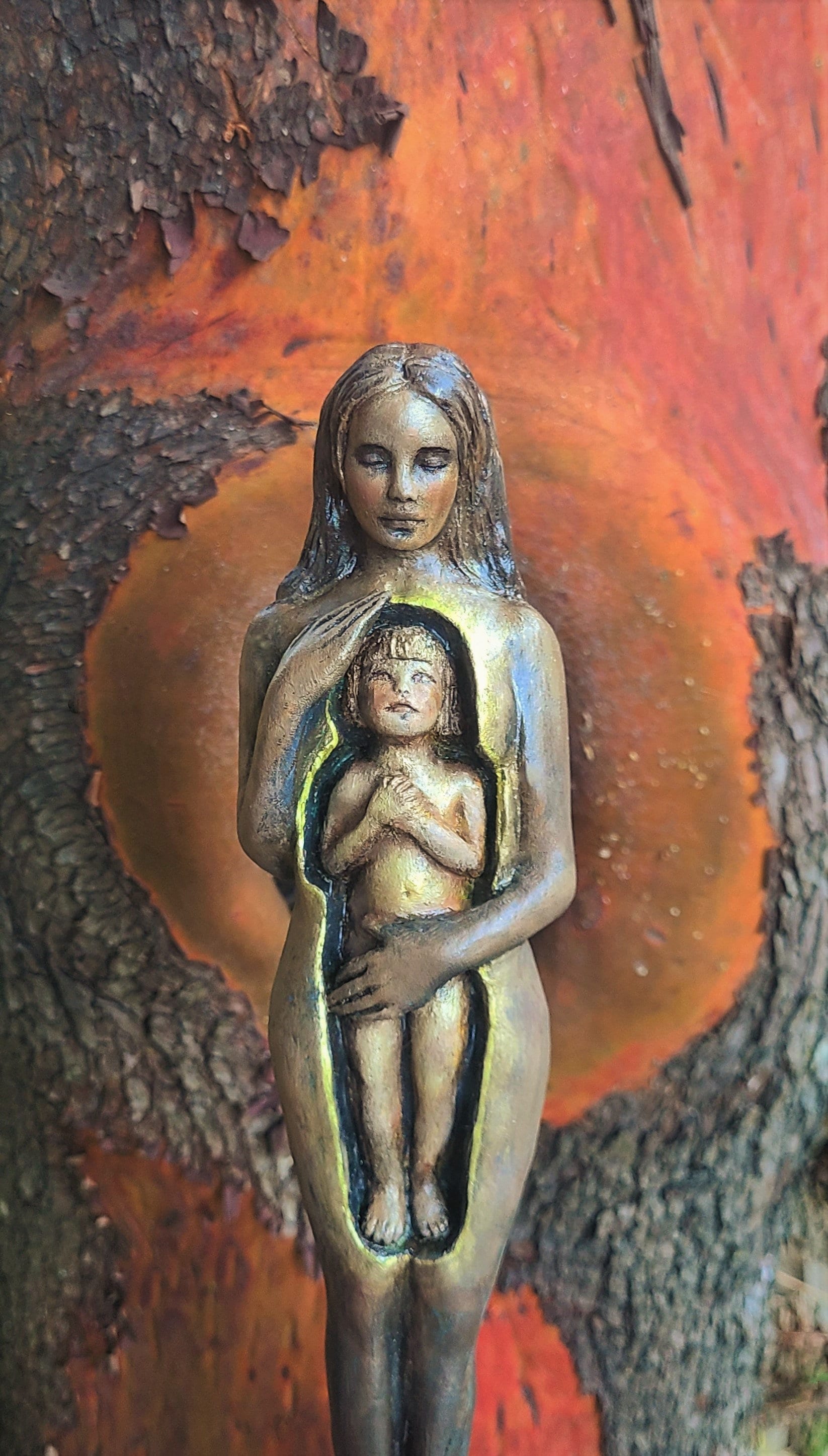 Inner Child healing sculpture symbolizing nurturing self love and emotional renewal by Debra Bernier