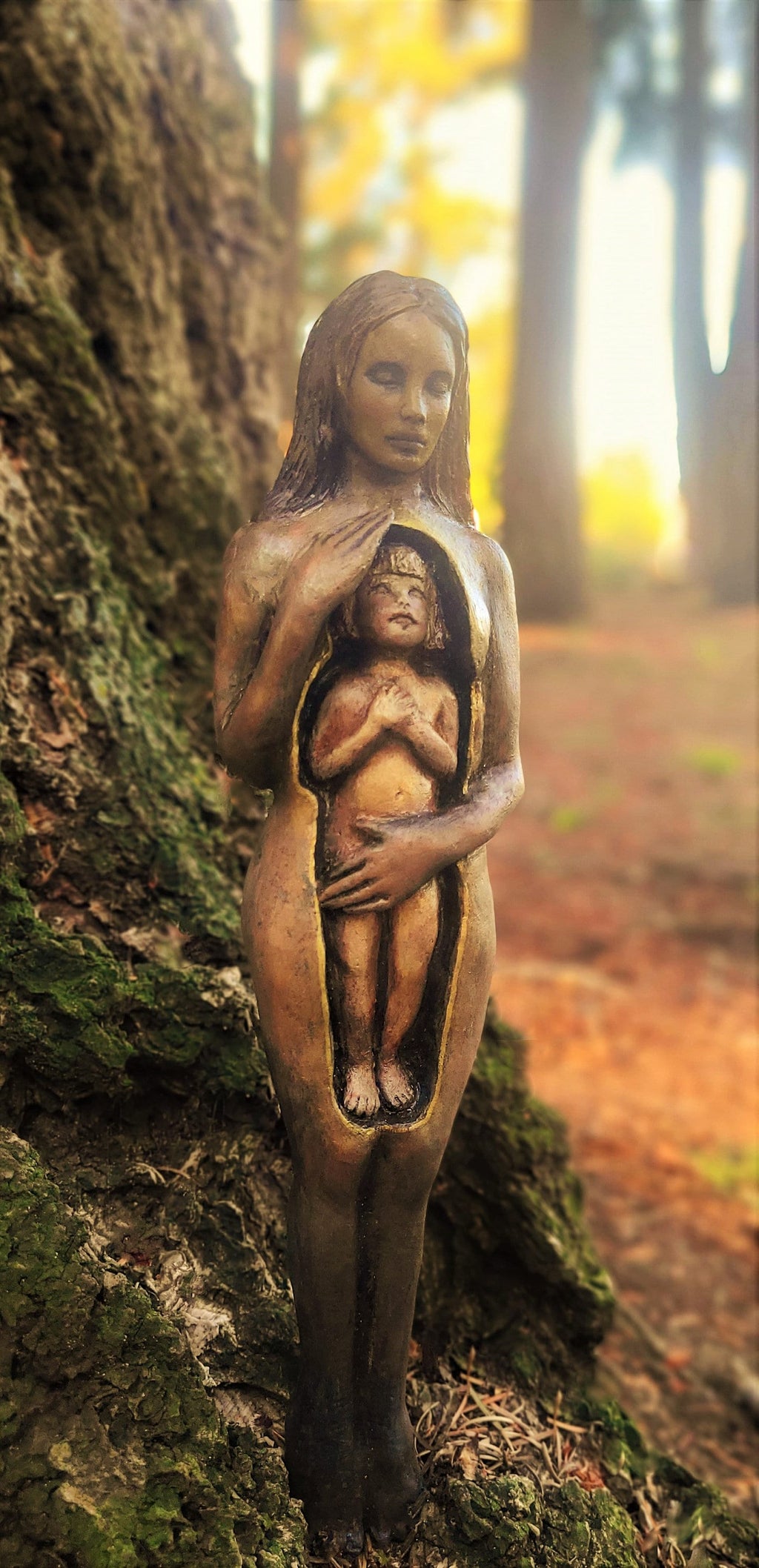 Close up of facial expression and emotional detail on Inner Child healing sculpture