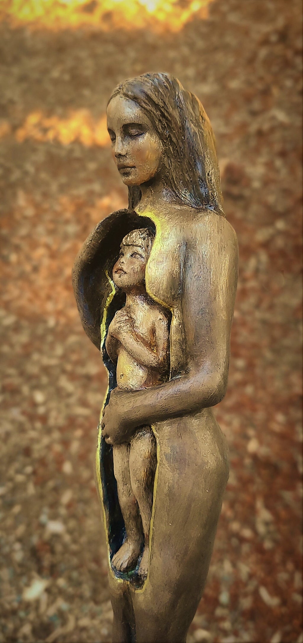 Side view of Inner Child sculpture showing gentle form and hand sculpted surface texture