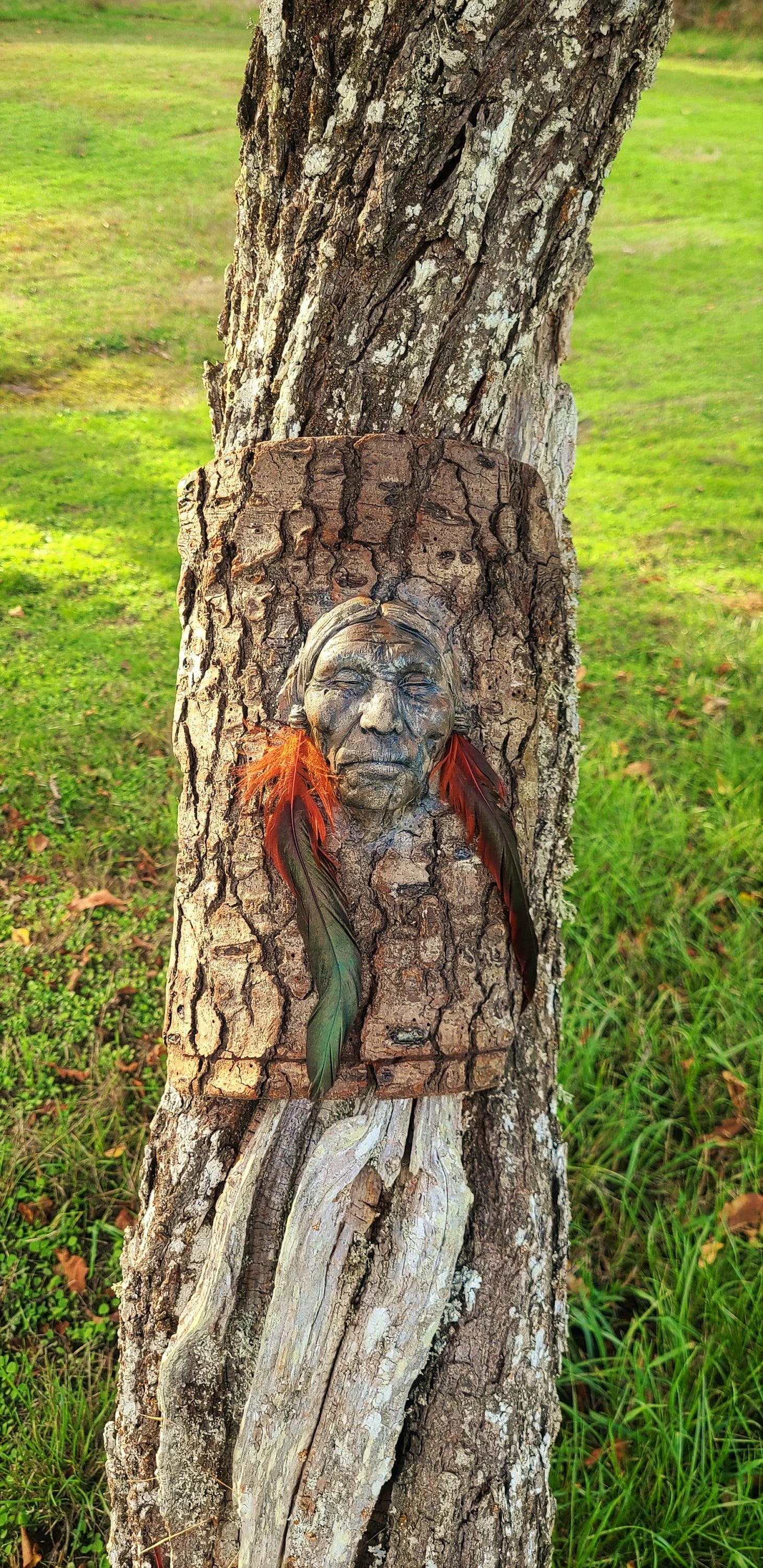 Close up of feather detail and bark texture on Listen to Your Heart spiritual wall sculpture