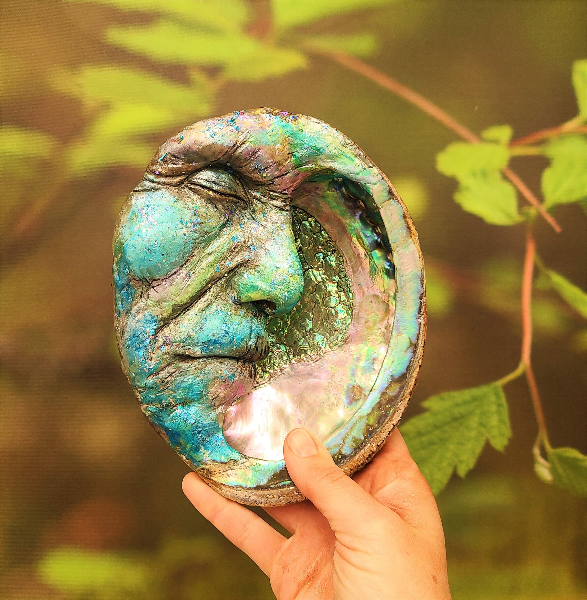 Man in the Moon abalone moon sculpture displayed in spiritual home decor and meditation space