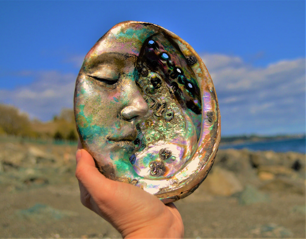 Moon of New Beginnings abalone moon sculpture styled in spiritual home decor and meditation space