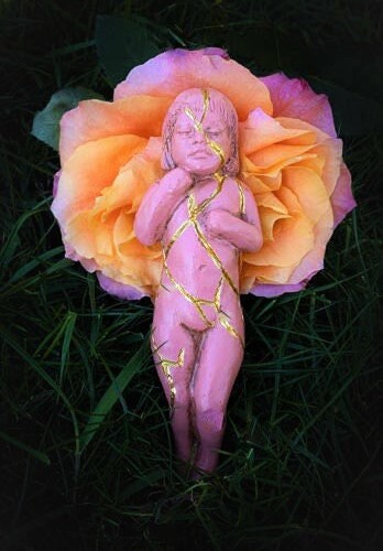 Pink Kintsugi healing sculpture symbolizing wholeness compassion and renewal by Debra Bernier