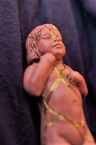 Side view of Pink Kintsugi sculpture showing soft pink finish and gentle sculptural form