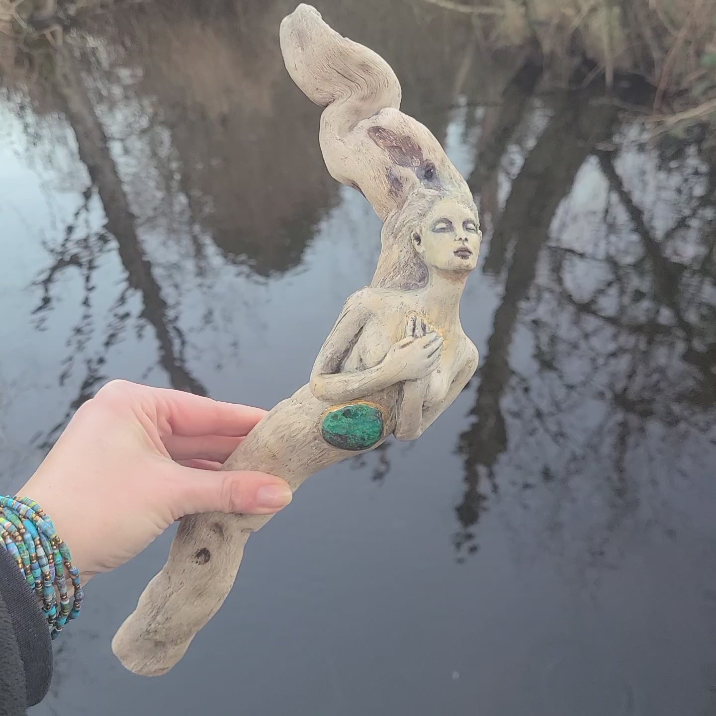 Close up of turquoise stone and wood texture on We Find the Way handmade root woman sculpture