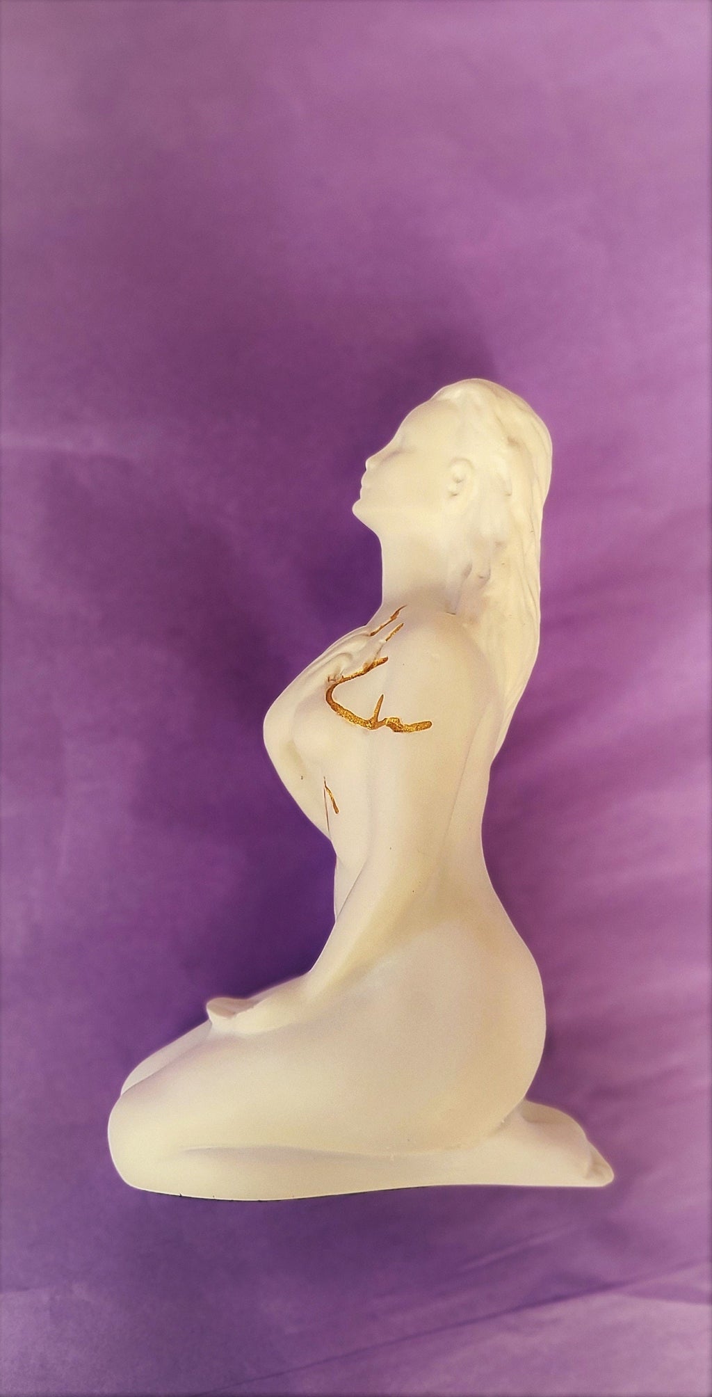 Detail view of Self Love white sculpture showing smooth surface texture and gentle feminine form