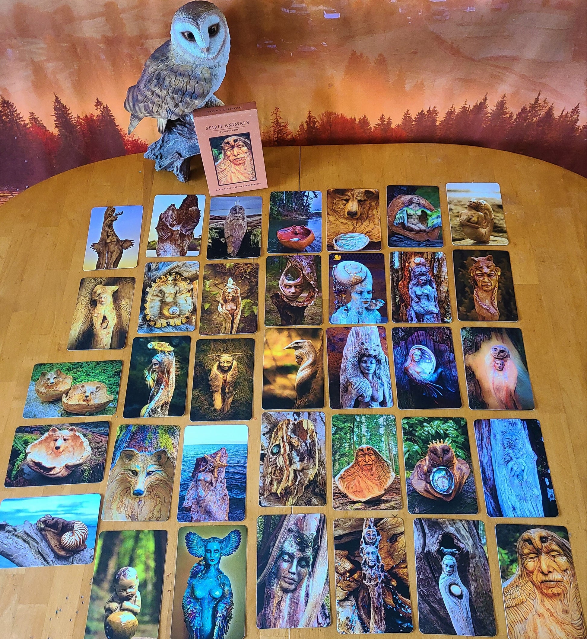 Spread of Spirit Animal Journey Deck cards showing animal artwork and inspirational messages
