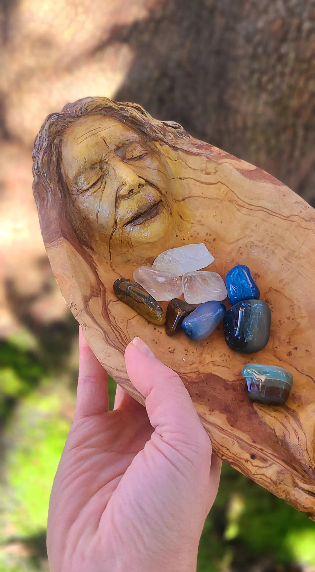 Close up of wood grain texture and hand carved detail on The Lives We Live bowl sculpture