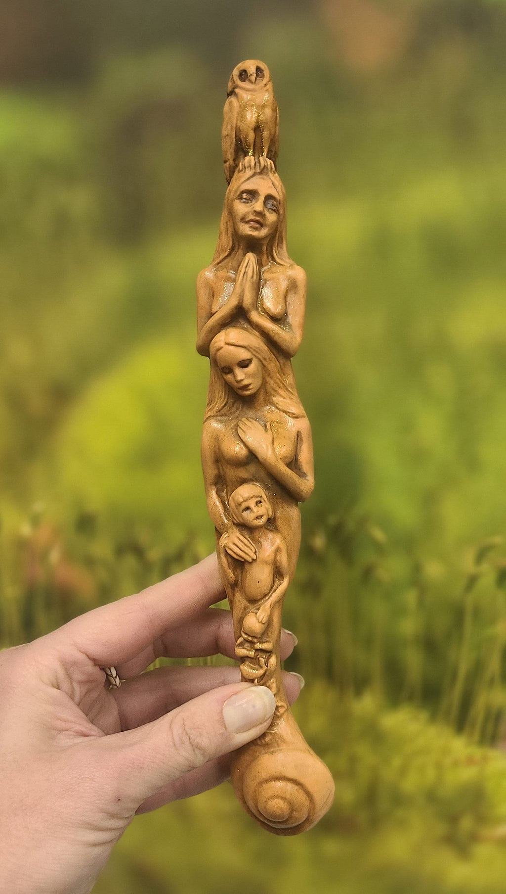Close up of tan surface texture and hand finished detail on Totem of Woman talking stick sculpture